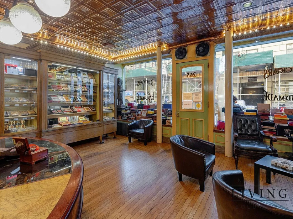 265 West 30th Street Manhattan, NY 10001 - Photo 2 of 20 a room with furniture pool table wooden floor and windows