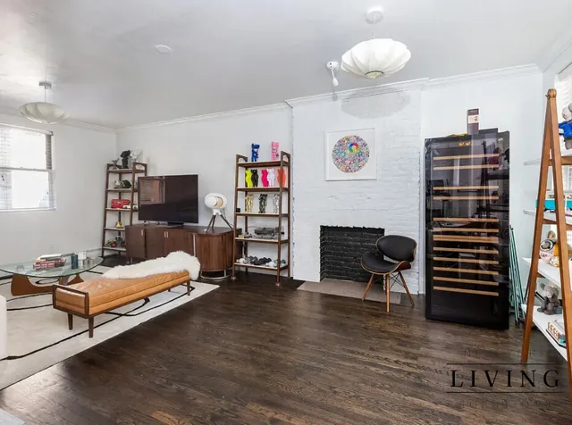 a bedroom with furniture and a fireplace