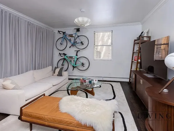 a bedroom with furniture and chandelier
