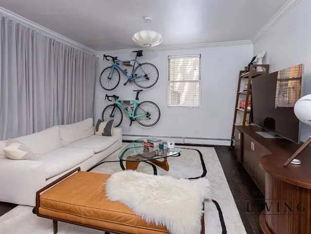 a bedroom with furniture and chandelier