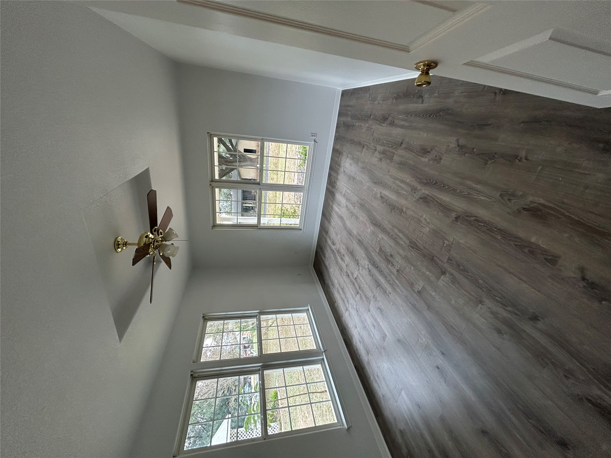 203 Maynard Street Bastrop, TX 78602 - Photo 14 of 27 wooden floor in an empty room with a window