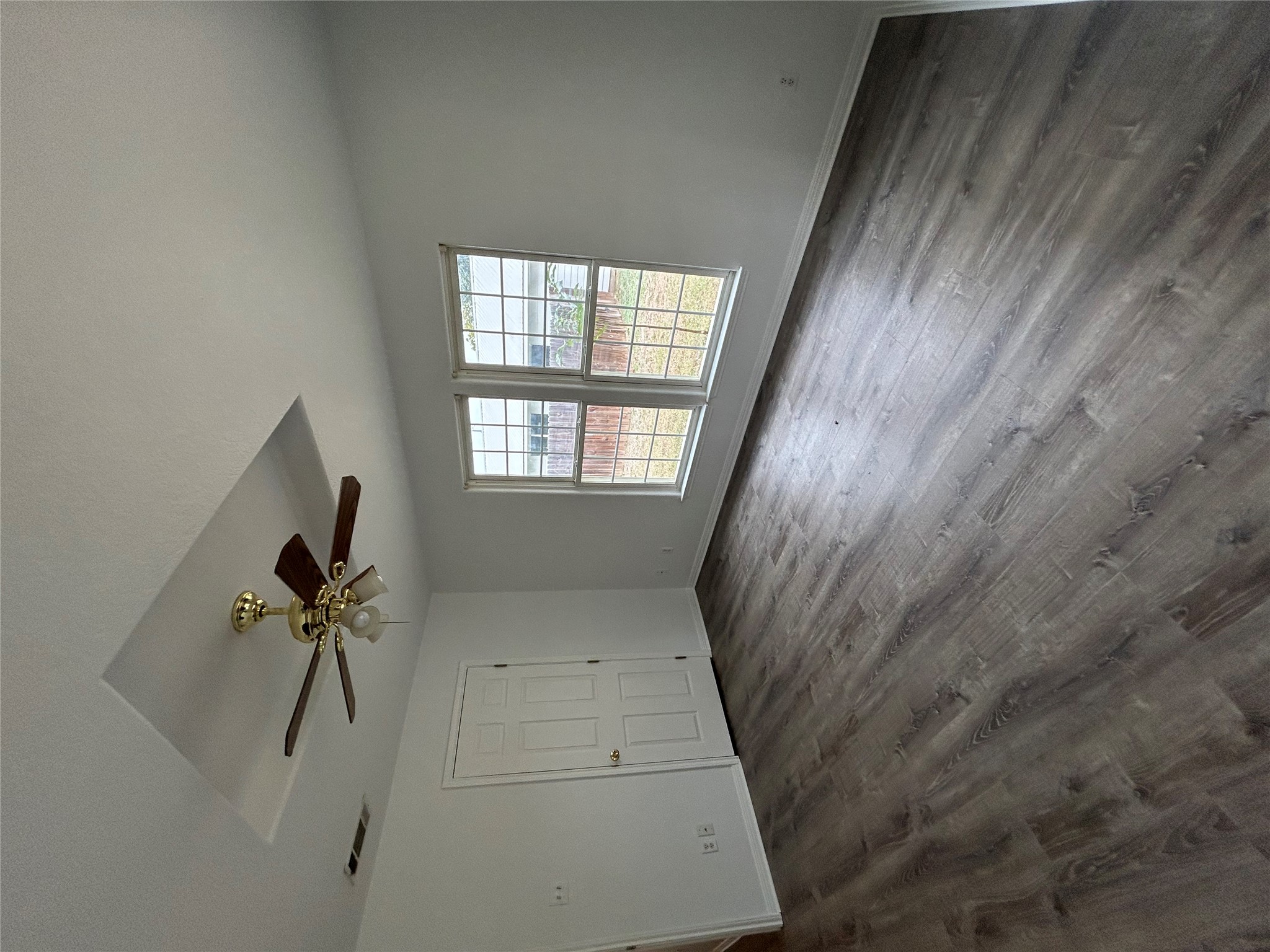 203 Maynard Street Bastrop, TX 78602 - Photo 15 of 27 wooden floor in an empty room with a window