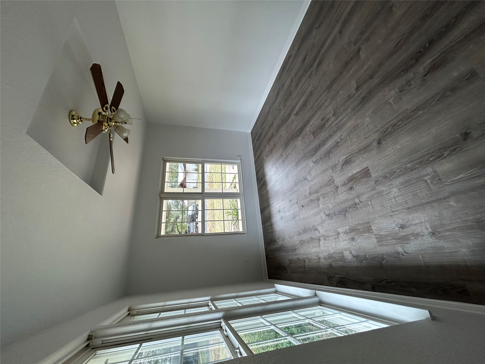 203 Maynard Street Bastrop, TX 78602 - Photo 16 of 27 a view of an empty room with wooden floor and a window