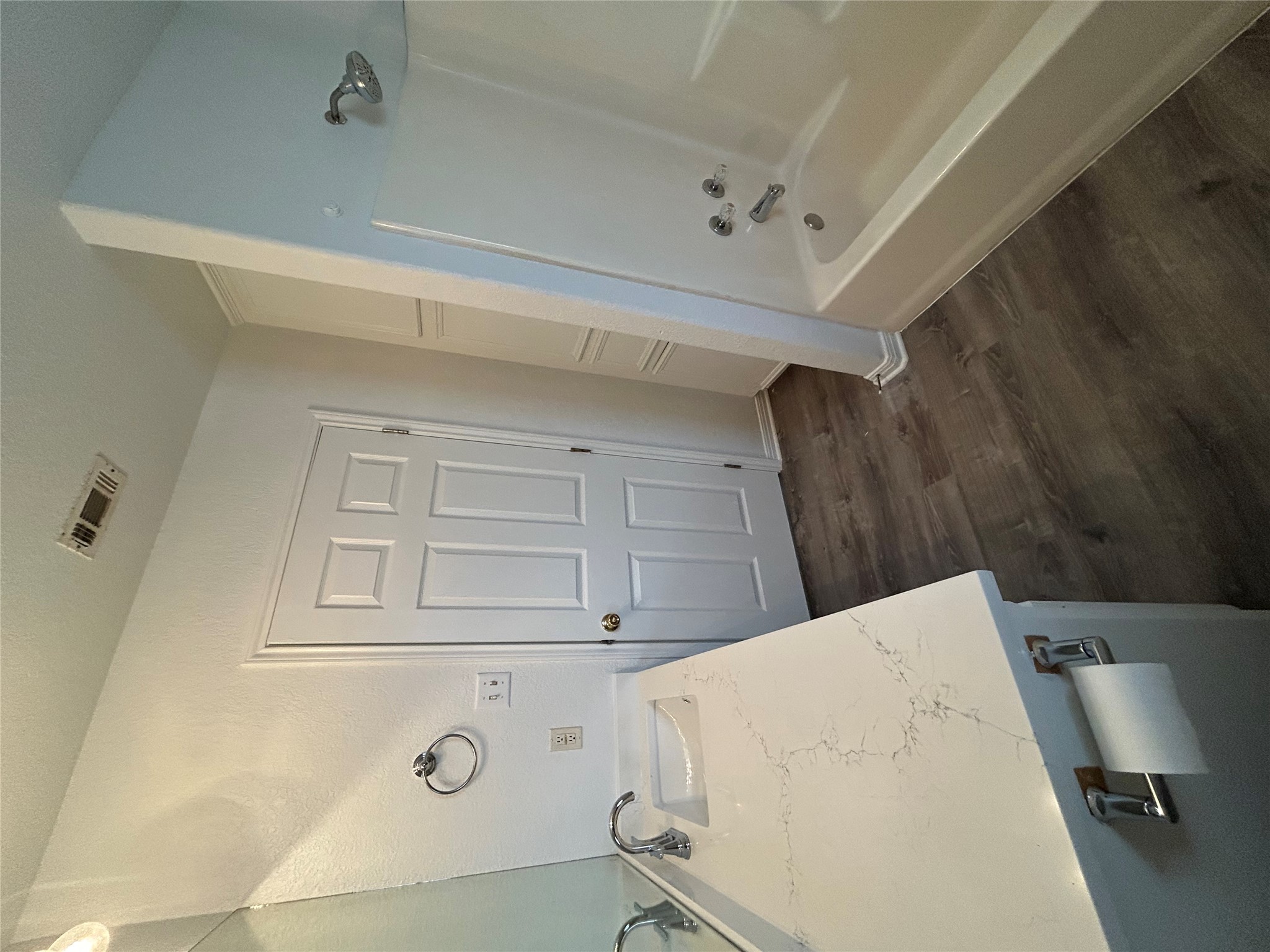 203 Maynard Street Bastrop, TX 78602 - Photo 18 of 27 a bathroom with a tub sink and mirror