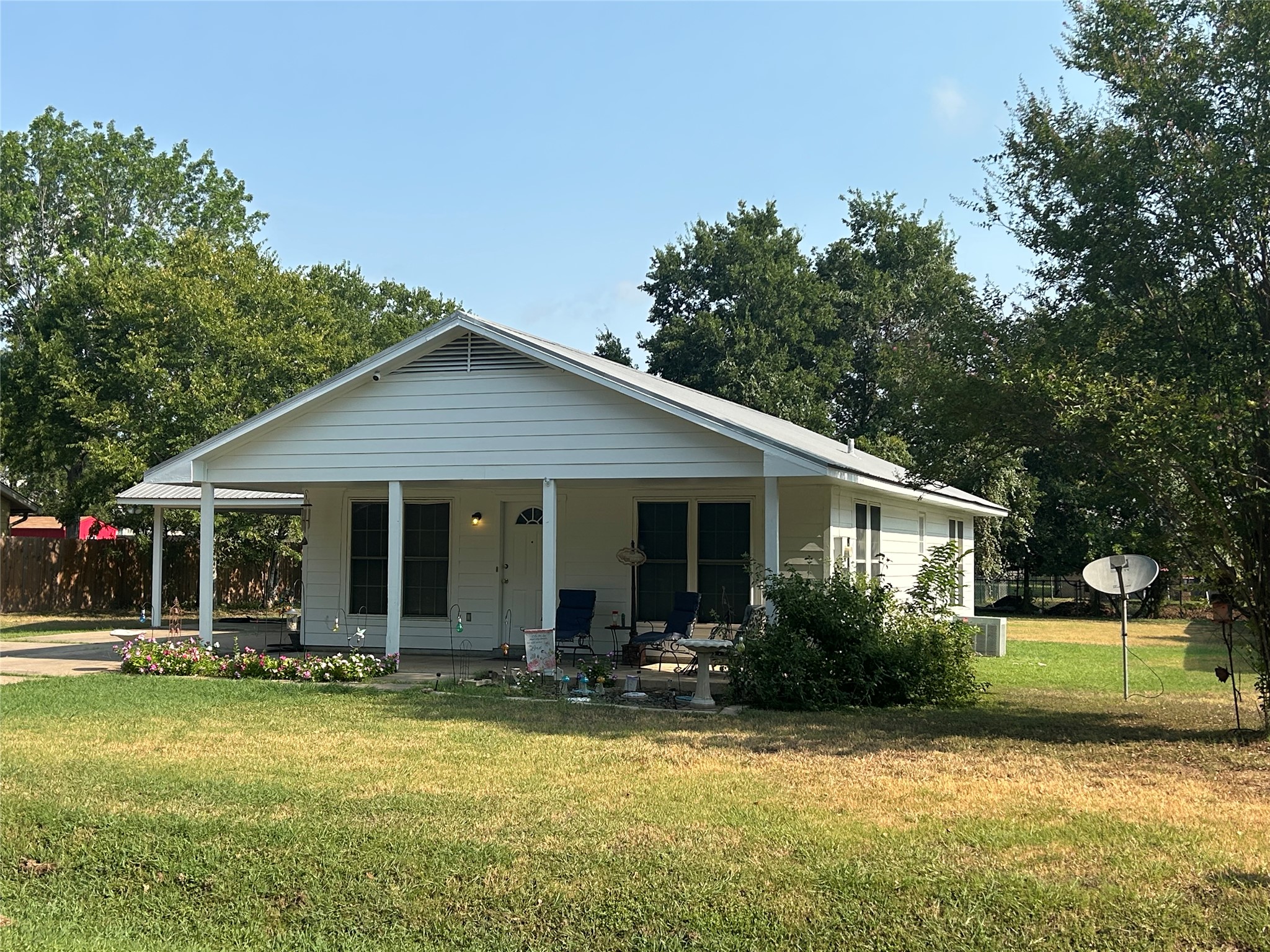 203 Maynard Street Bastrop, TX 78602 - Photo 2 of 27 a view of a house with backyard and sitting area