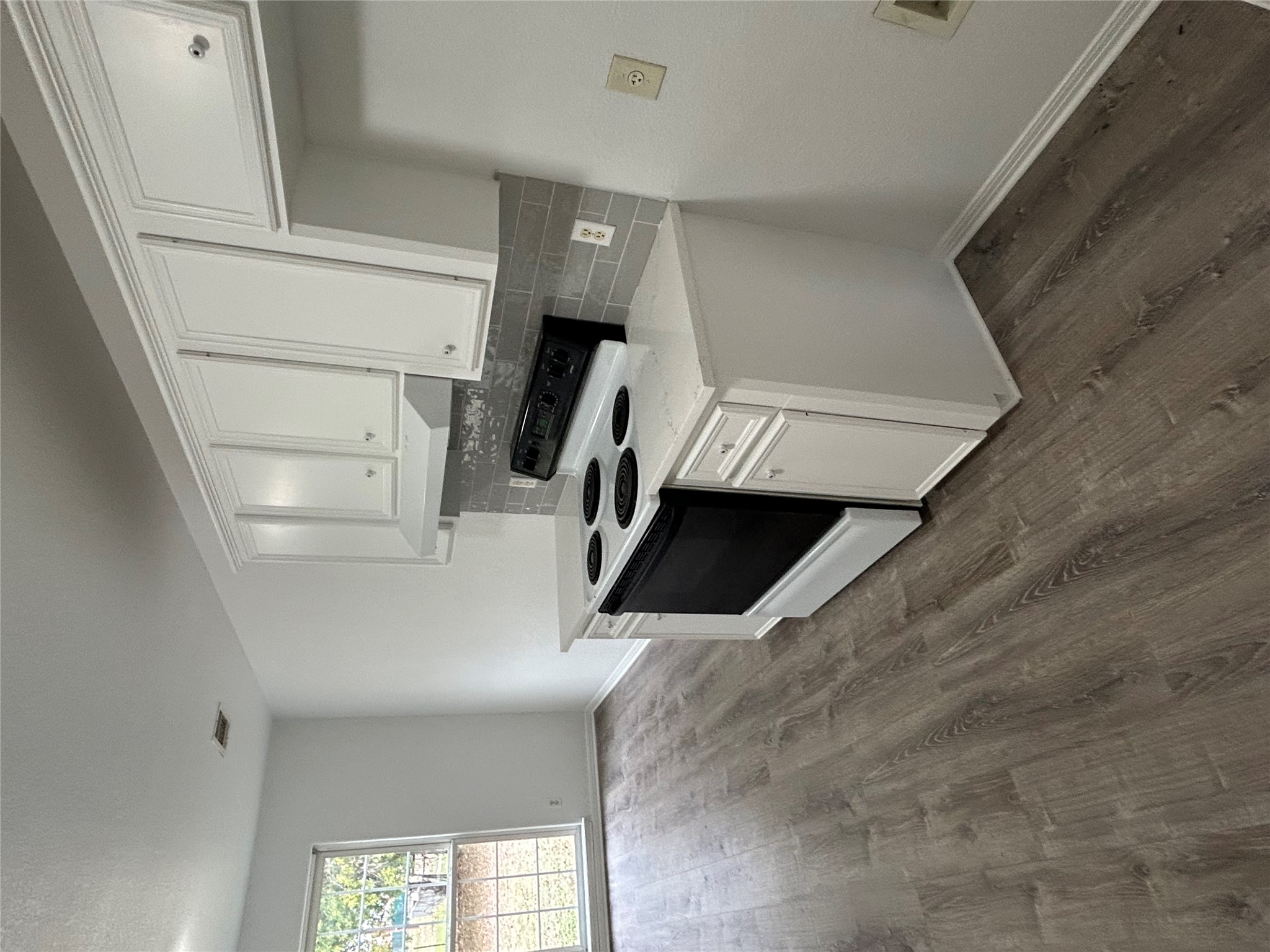 203 Maynard Street Bastrop, TX 78602 - Photo 7 of 27 a utility room with wooden floor washer and dryer