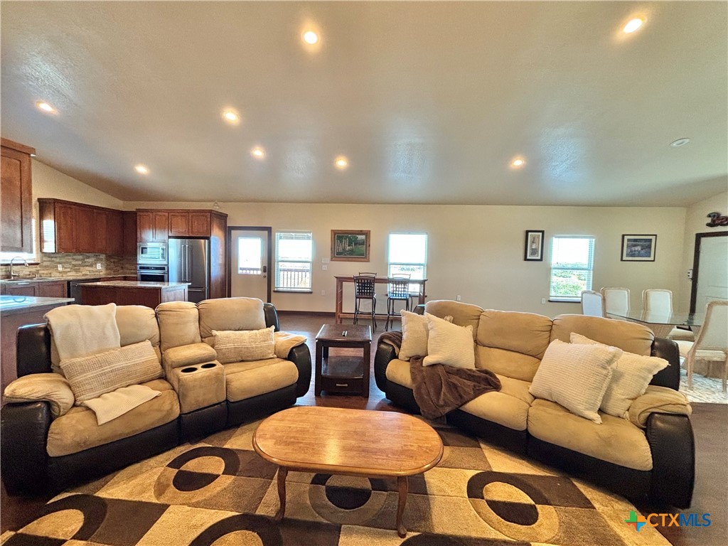 174 Riley Lane Port O'Connor, TX 77982 - Photo 21 of 47 a living room with furniture and a large window