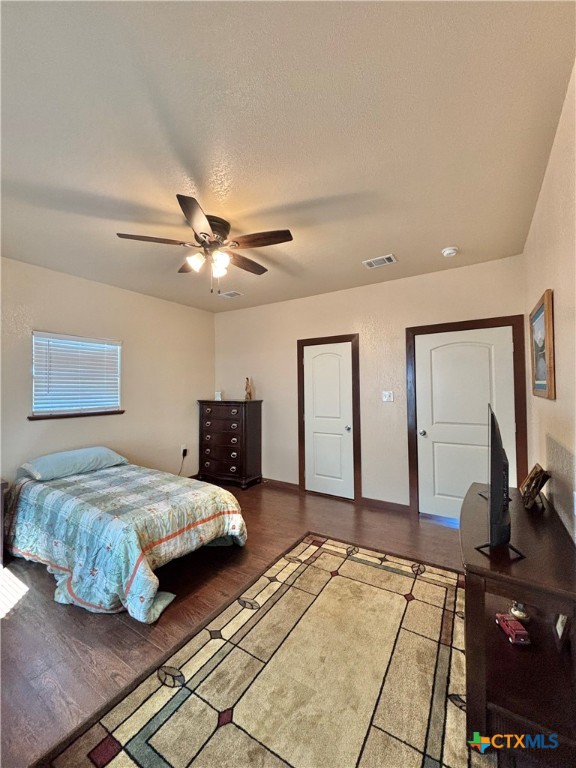 174 Riley Lane Port O'Connor, TX 77982 - Photo 35 of 47 a bedroom with a bed and two large mirror