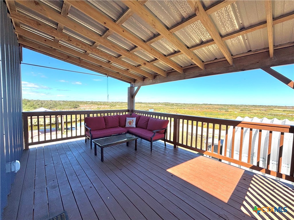 174 Riley Lane Port O'Connor, TX 77982 - Photo 4 of 47 a view of a balcony with furniture