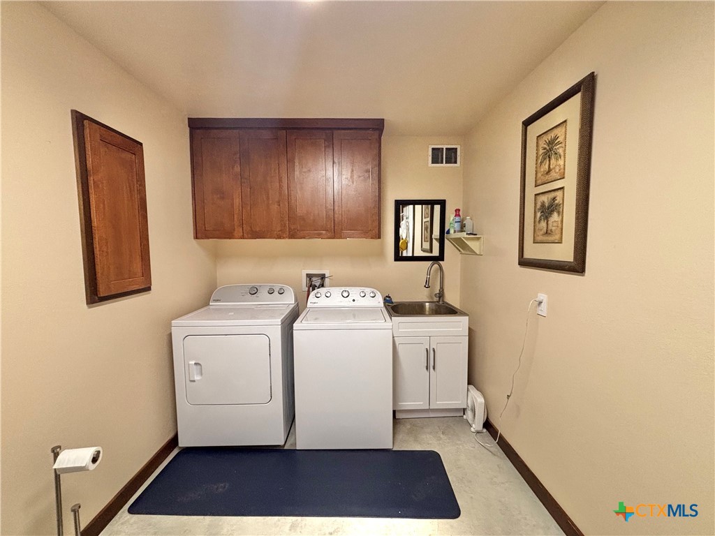 174 Riley Lane Port O'Connor, TX 77982 - Photo 45 of 47 a utility room with dryer and washer