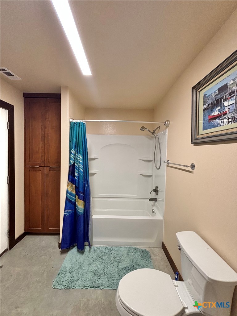 174 Riley Lane Port O'Connor, TX 77982 - Photo 46 of 47 a bathroom with a toilet and a shower