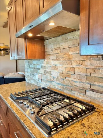 a view of a kitchen with a sink