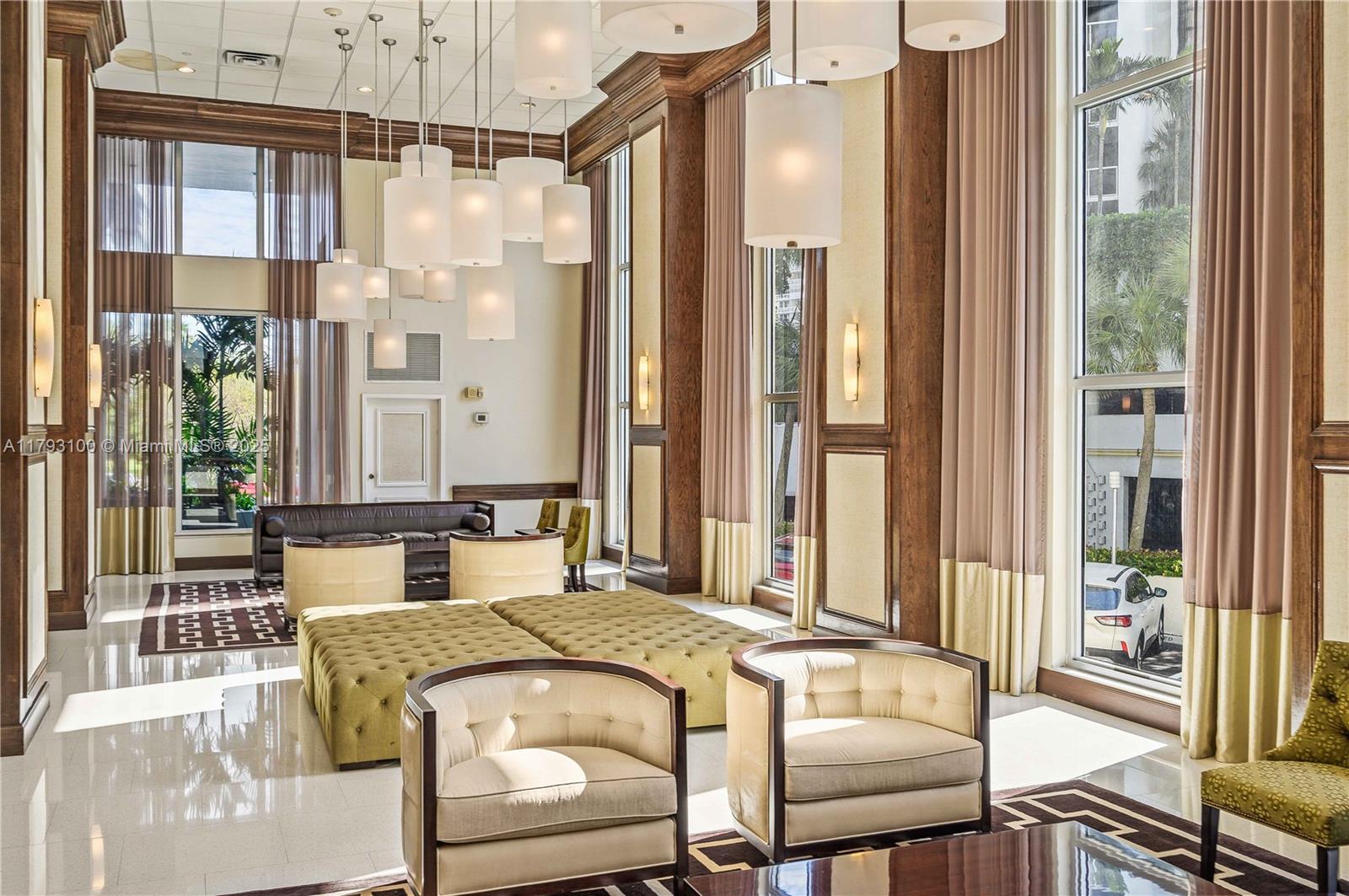 5 Island Avenue, Unit 15A Miami Beach, FL 33139 - Photo 12 of 19 a bedroom with a bed and a large window