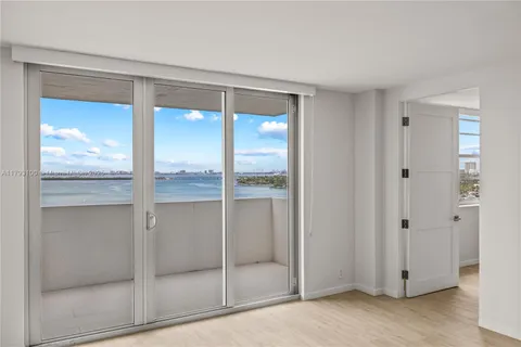 a bathroom with a glass shower door
