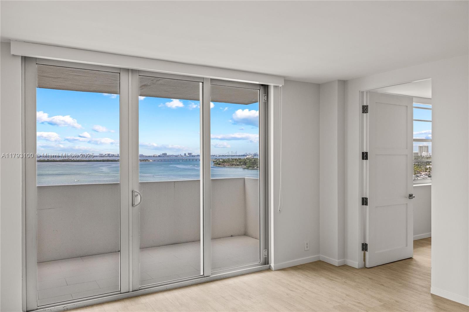 5 Island Avenue, Unit 15A Miami Beach, FL 33139 - Photo 2 of 19 a bathroom with a glass shower door