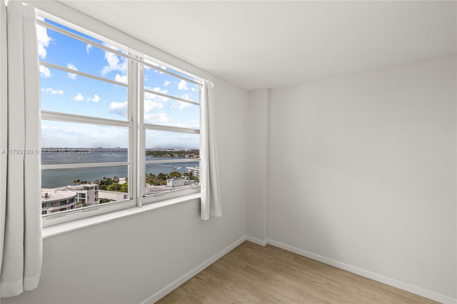 5 Island Avenue, Unit 15A Miami Beach, FL 33139 - Photo 6 of 19 a view of empty room with large window