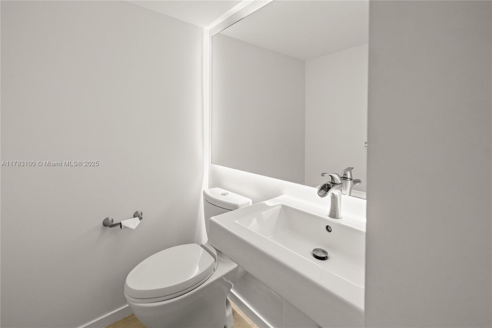 5 Island Avenue, Unit 15A Miami Beach, FL 33139 - Photo 10 of 19 a bathroom with a granite countertop toilet and a sink