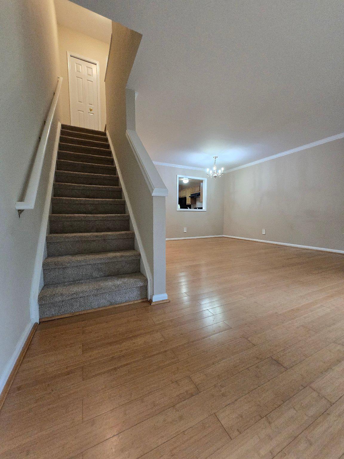 1765 Rochelle Court Woodbridge, VA 22192 - Photo 12 of 34 Staircase from open living + dining space.