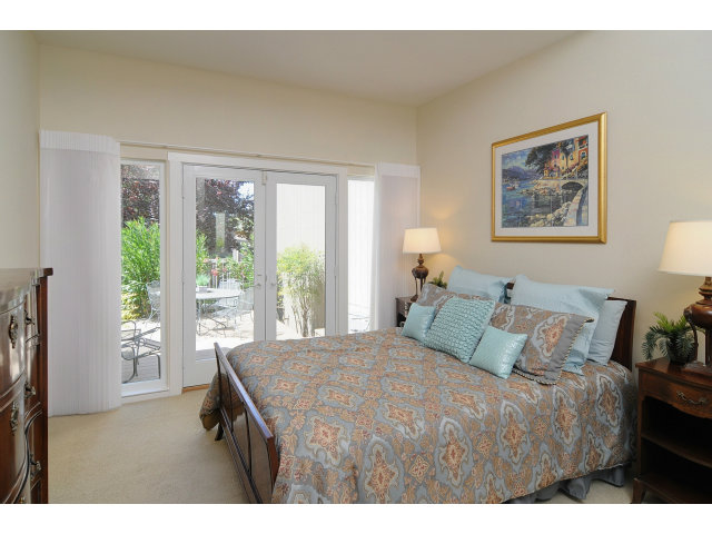37 Farm Road Los Altos, CA 94024 - Photo 6 of 9 a bedroom with a bed and a large window