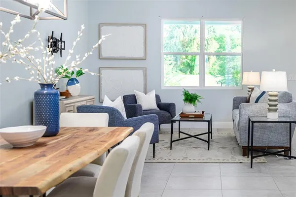 a work room with furniture and a potted plant