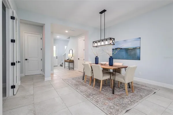 a dining room with furniture and window