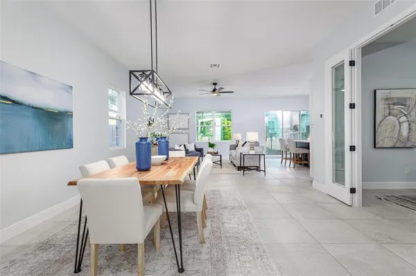 a dining room with furniture and window