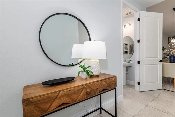 a room that has a bed and a mirror