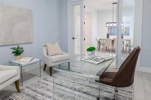 a hall way with closet and a mirror