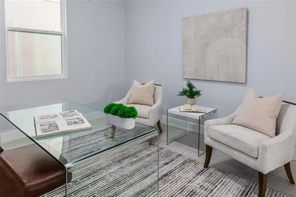 a large bed sitting in a bedroom next to a window