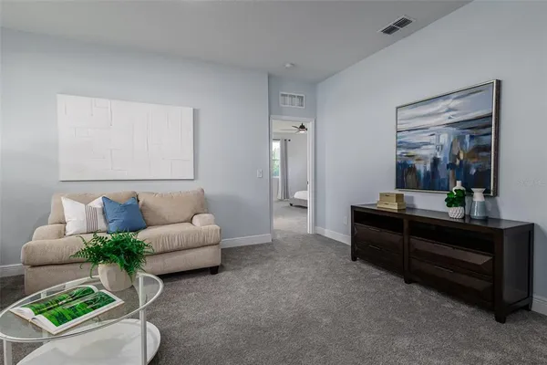 a bathroom with a granite countertop sink a toilet and shower