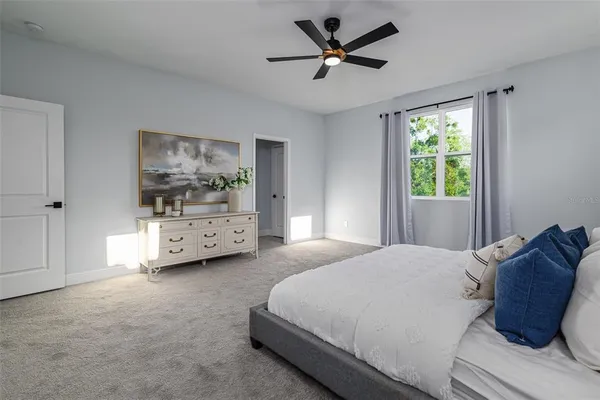 a front view of a house with a garden and yard