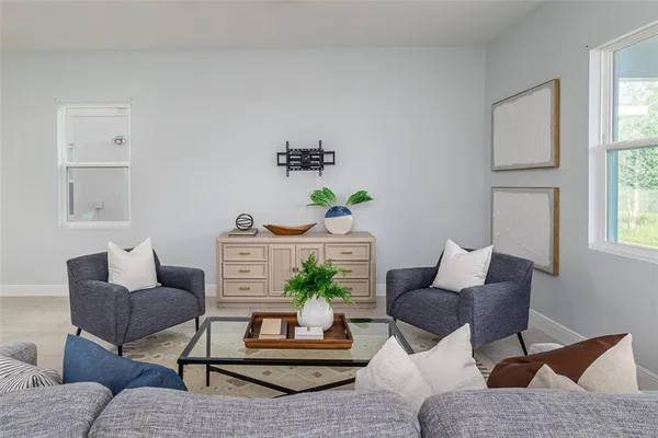 a living room with furniture and a window