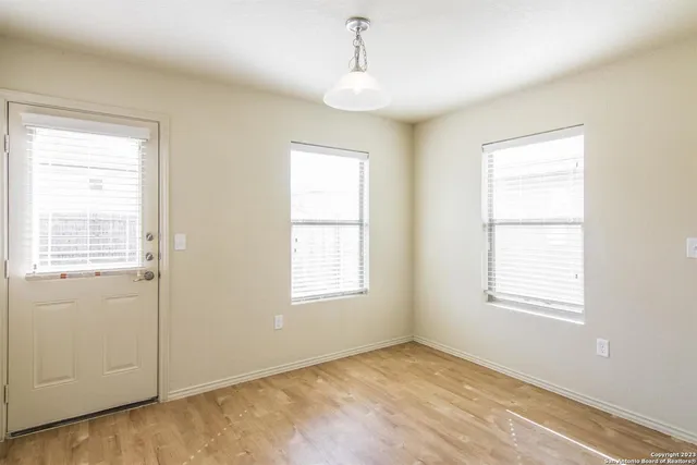 an empty room with windows