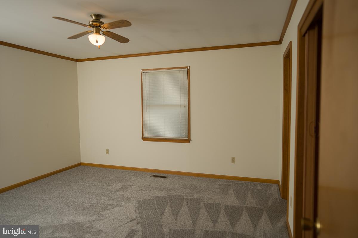 13148 Fleetwood Pond Road Seaford, DE 19973 - Photo 11 of 25 a view of an empty room with a window