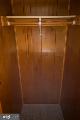 a white toilet sitting next to a shower