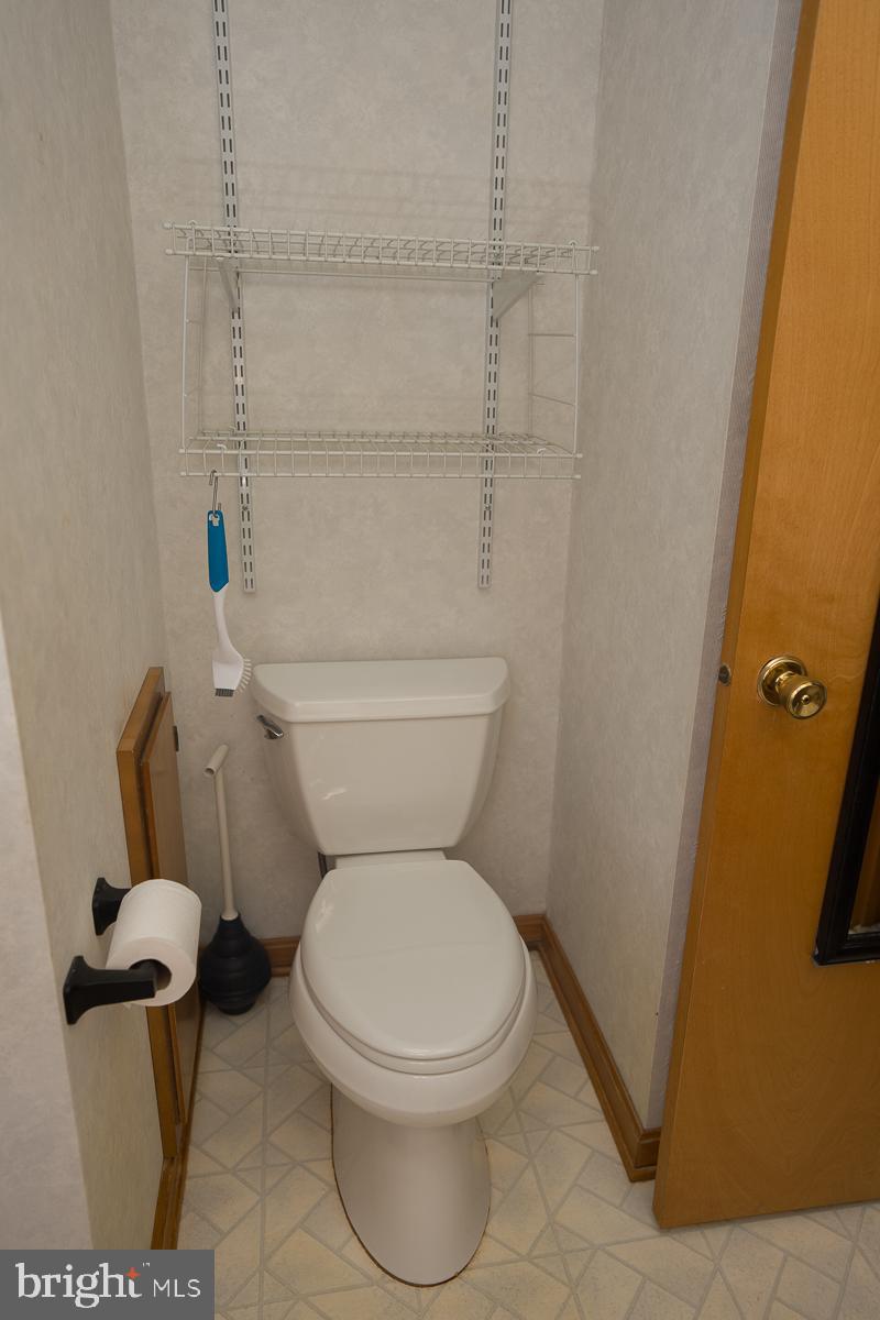 13148 Fleetwood Pond Road Seaford, DE 19973 - Photo 15 of 25 a white toilet sitting next to a shower