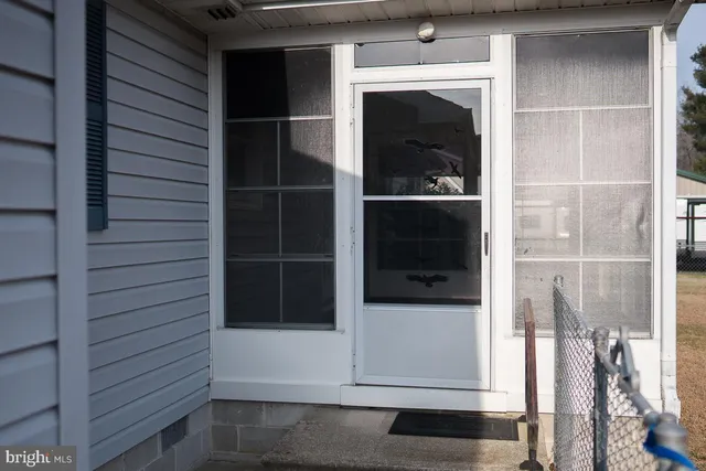 a front view of a house with a large window