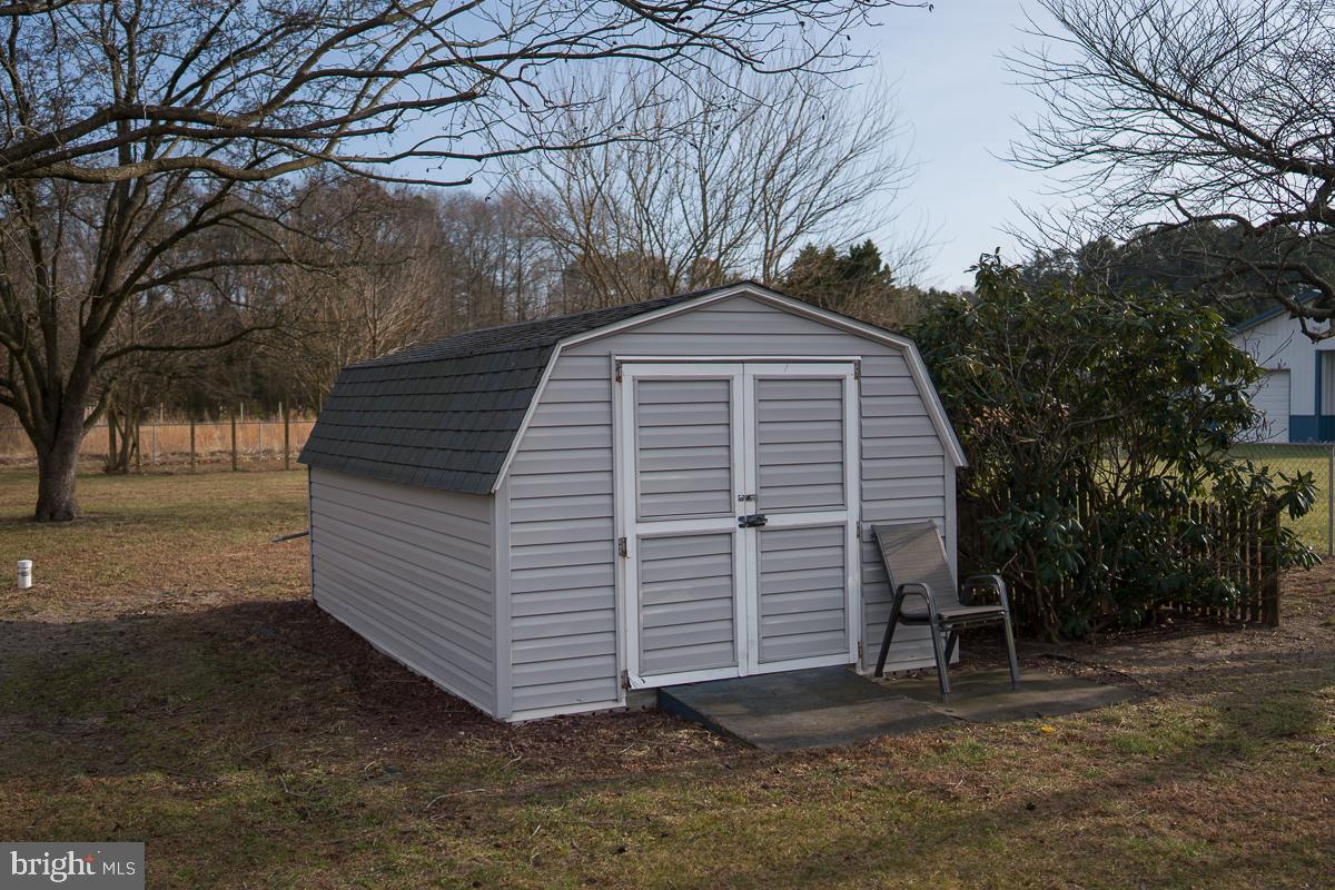 13148 Fleetwood Pond Road Seaford, DE 19973 - Photo 22 of 25 a view of a house with a yard