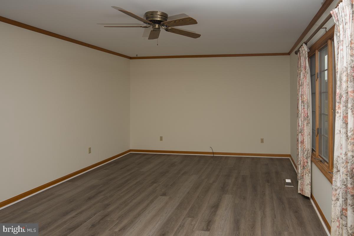 13148 Fleetwood Pond Road Seaford, DE 19973 - Photo 5 of 25 a view of small space with wooden floor and a window