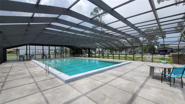 a view of a swimming pool with a patio