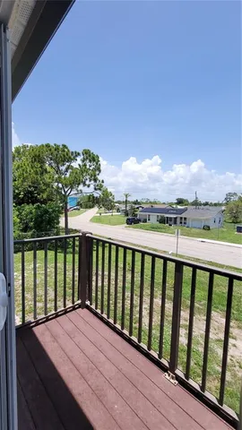 a view of balcony with furniture
