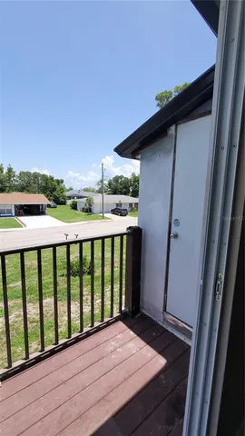 a view of balcony with wooden floor and outdoor space