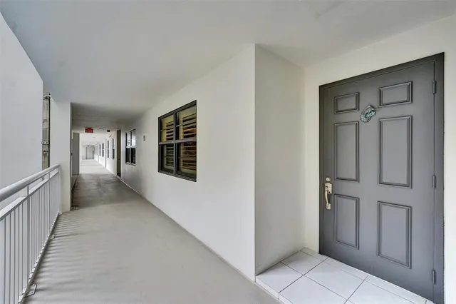 a view of hallway with windows