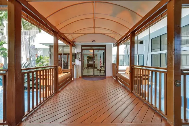 a view of a porch with wooden floor and outdoor space