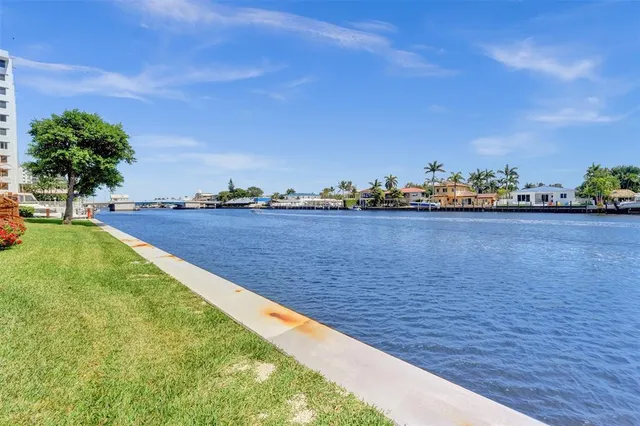 a view of a lake with a big yard
