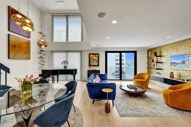a living room with furniture fireplace and window
