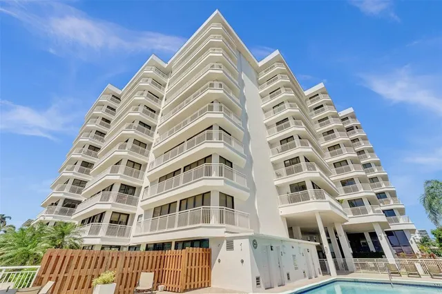 a view of a patio with table and chairs and potted plants