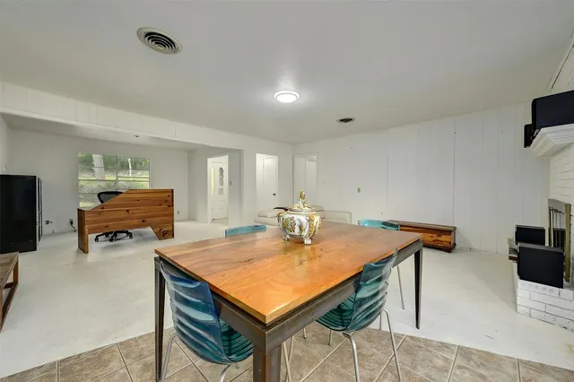 a kitchen with refrigerator and window