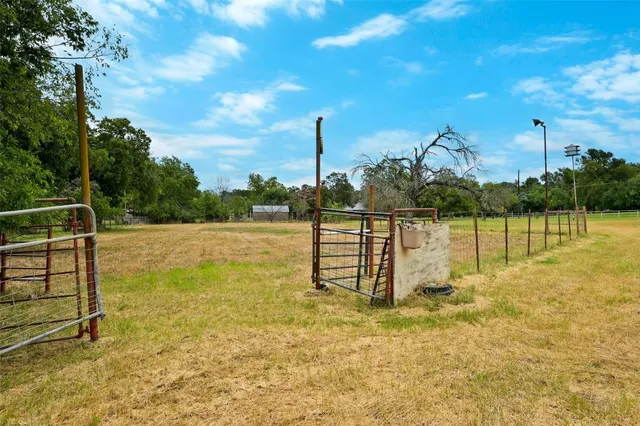 a view of a field with an trees