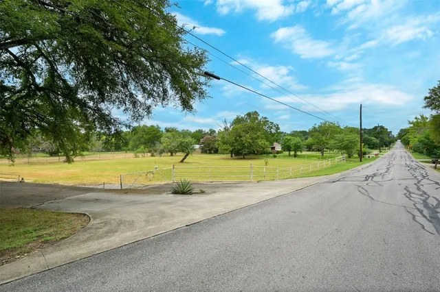 a view of a swimming pool and a yard